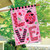 Briarwood Lane Ladybug Love Double-Sided House Flag, pink with ladybugs and floral designs.