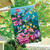 Briarwood Lane Springtime Hummingbirds House Flag with colorful floral and bird design on a house exterior.