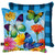 Briarwood Lane Fluttering Butterflies Indoor Outdoor Pillow with colorful butterflies and flowers on blue background.