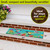 Briarwood Lane Hummingbird Greeting Mini Mat, 22" x 10", colorful hummingbird design on green background.