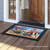 Briarwood Lane Dog Days Beach Doormat with colorful dog beach scene and black border.