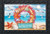 Briarwood Lane Coral Wreath Doormat with seashells and starfish on a beach background welcomes guests.