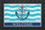 Briarwood Lane Welcome Anchor Doormat with blue anchor and rope on nautical striped background.