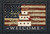 Briarwood Lane Patriotic Birdhouse Doormat with American flag design and welcome message in white text.