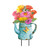 Briarwood Lane Gerber Daisy Watering Can Metal Art with colorful flowers and butterflies on a stand.