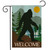Briarwood Lane Bigfoot Welcome Garden Flag with silhouette of Bigfoot and welcome text on brown background.