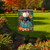 Briarwood Lane colorful pumpkin stack garden flag with black, white and orange pumpkins and floral design.