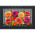 Vibrant orange, pink, and yellow mums on black and white checkered doormat with decorative border.