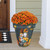 Large gray Fall Gnomes planter with vibrant orange flowers and autumnal gnome design on porch step.