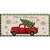 Red vintage pickup truck with Christmas tree and snowflakes on mini mat, Merry Christmas theme.