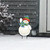 Snow Time Snowman Metal Art, white snowman with red, green, and blue hat and scarf.