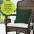 Tropical Leaves Burlap Pillow, green and white leaf pattern on burlap, on a wicker chair.