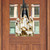 Rejoice Nativity Wood Door Hanger with figurines of Mary, Joseph, and animals on a ribbon.