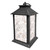 Distressed black metal lantern with white and gold patterned glass panels and roof handle.