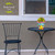 Bee Happy Beehive Small Planter on a table with chair, colorful flowers, and Briarwood Lane branding.