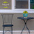 Briarwood Lane Springtime Hummingbirds small planter on a black metal table with a chair nearby.