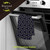 Blue geometric cotton hand towel with yellow lines, hanging on oven door handle, Briarwood Lane brand.
