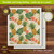 Pineapples and Leaves Swedish Dishcloth, 6.75"x7.5", colorful pineapple and leaf pattern on beige background.