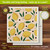 Lemons Swedish Dishcloth, 6.75x7.5 inches, yellow lemons and green leaves on beige background, textured.
