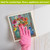 Farm Fresh Flower Swedish Dishcloth with pink glove on hand wiping surface with colorful floral design.