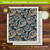 Paisley Swedish Dishcloth, dark blue with beige and gold paisley patterns, 6.75 x 7.5 inches.