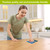 Woman wiping table with Colorful Hydrangeas Swedish Dishcloth in a modern kitchen setting.