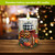 Patterned Pumpkins Flameless Candle, battery operated LED candle with lit flame on wooden surface.