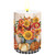 Autumn Arrangement Flameless Candle with fall flowers and pumpkins on a wood grain background.
