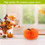 Orange pumpkin honeycomb paper decor, medium size, 4.8 x 6.3 inches, vibrant fall decoration.