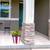 American Flag Medium Planter with yellow flowers on a front porch, red, white, and blue colors.