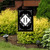Black and white monogram garden flag with H, double-sided, decorative floral pattern on black background.