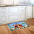 Bless This Home Cardinal Doormat with vibrant red cardinals, white flowers on a blue background.