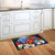 American Cardinal Doormat with colorful floral design and vibrant cardinal on wooden kitchen floor.