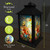 Briarwood Lane Floral Birdhouses Lantern, black metal frame, colorful bird design, shatter-resistant acrylic panels.