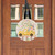 Easter Egg Wreath Wood Door Hanger with yellow truck and Happy Easter text on white background.