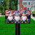 Saluting Gnome Mailbox Cover with patriotic gnomes and American flag design on a black mailbox.