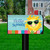 Hello Summer Sun Mailbox Cover with colorful design and smiling sun wearing sunglasses on a lawn.