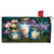 Be a Light Jars Mailbox Cover with lit candles in jars and flowers on grass.