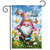 Springtime Gnome Garden Flag with colorful garden gnome and butterflies among flowers outdoors.