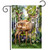 Deer in Forest Garden Flag with two deer standing in a forest surrounded by flowers trees.