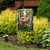Deer in Forest Garden Flag with two brown deer in a woodland setting on a garden stand.