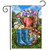 In the Spring Garden Garden Flag with blue boots, watering can, and colorful flowers and birds.