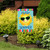 Hello Sun Summer Garden Flag with smiling sun wearing sunglasses on a colorful background outdoors.