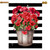 Striped house flag with red geraniums in a wooden bucket on black and white stripes background.