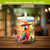 Sunset Parrot Flameless Candle with colorful parrot design, LED flame, on wooden surface, tropical pattern.