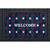 Wood American Flag Doormat with welcome text and red, white stars on blue wood grain background.