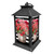 Black metal Striped Geraniums Lantern with pink flowers in white pots on white background.