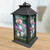 Black metal lantern with colorful floral design and Be a Light To the World text.