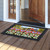 American Flower Field Doormat with red, white, and blue bunting design on wooden porch floor.