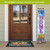 Easter Celebration Pine Reversible Porch Leaner with Welcome Home design on a house porch.